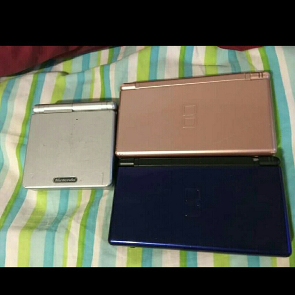 Pink Nintendo ds and grey gameboy advanced